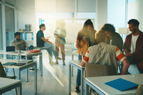 Education, lecture and relax with students in classroom for discussion, college or exam feedback. University lesson, scholarship opportunity and support with group of people on campus for test report