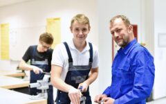 Group of young people in technical vocational training with teacher